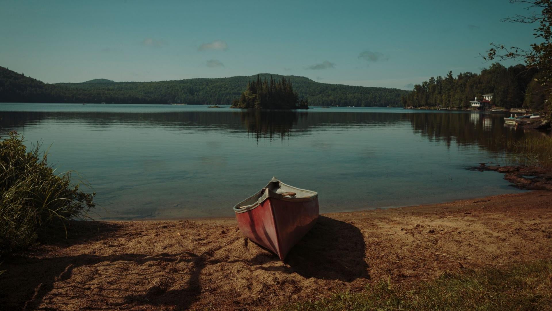 canoe-resting-on-small-beach.jpg